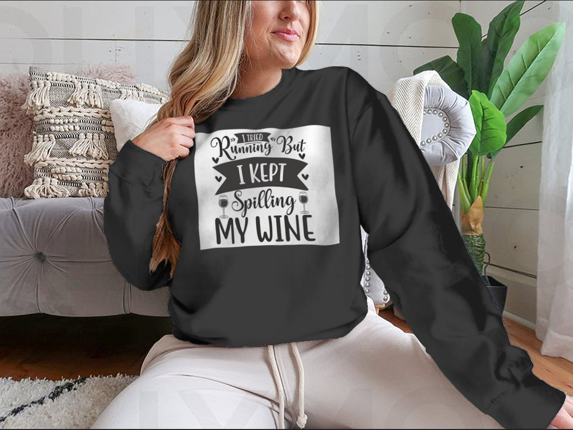 A cozy sweatshirt featuring the humorous phrase 'I Tried Running But I Kept Spilling My Wine', perfect for wine lovers.